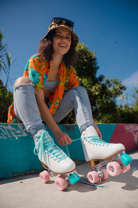 Woman Putting on Roller Skates